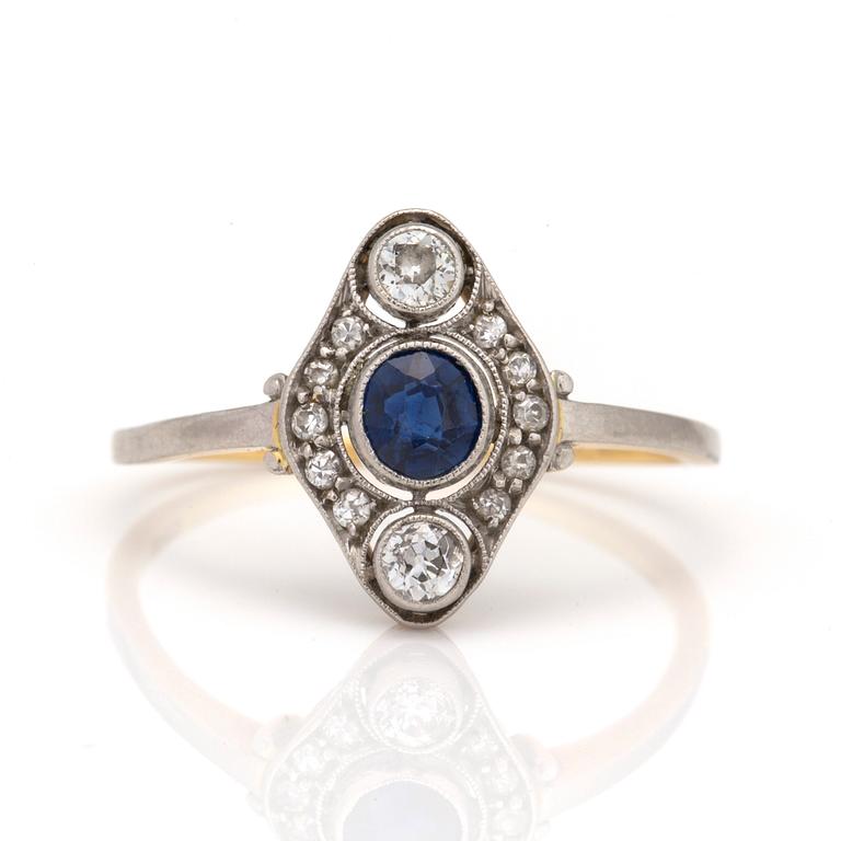 A ring with a cushion-cut sapphire and old-cut diamonds.