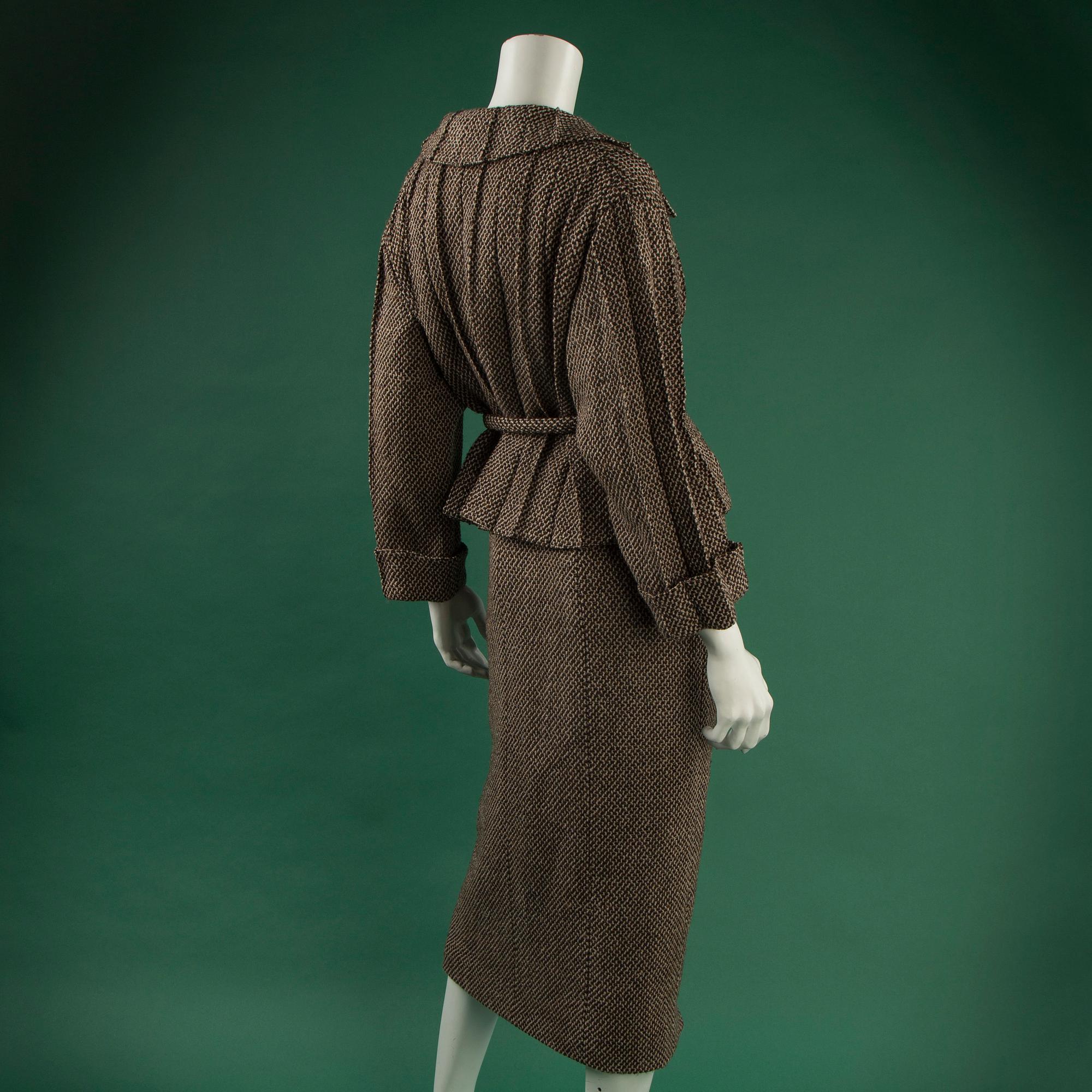 A TWO PIECE CHANEL SUIT, size 38 (FR).