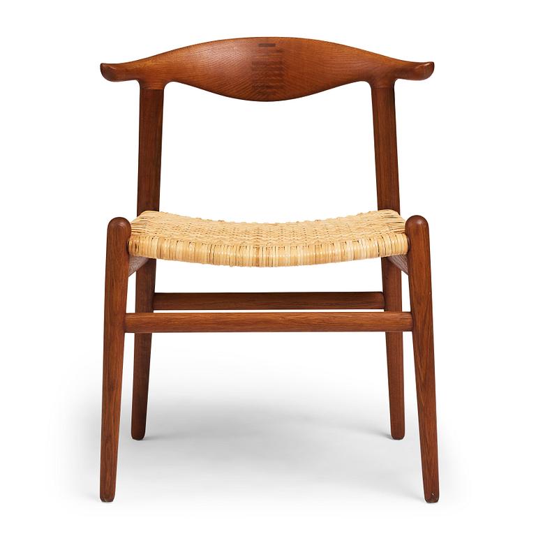 Hans J. Wegner, a teak, oak and cane "Cowhorn chair", JH 505, Johannes Hansen, Denmark 1950-60's.