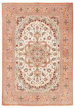 A signed silk Qum rug, ca 197 x 136 cm.