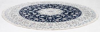 A Nain rug, diameter 243 cm.