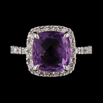 1107. A 4.50 ct amethyst and 0.55 ct diamond ring.