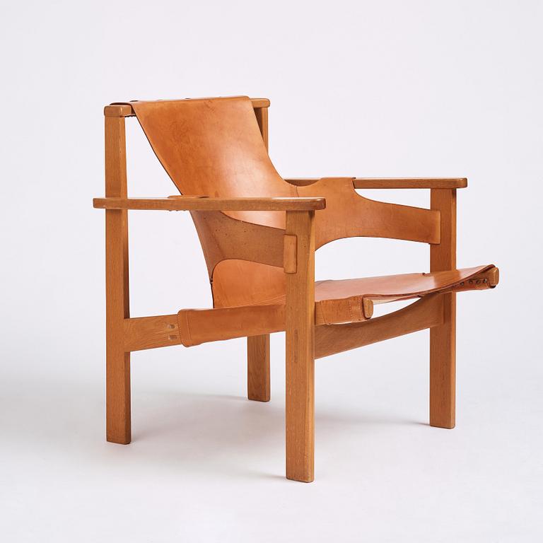 Carl-Axel Acking, an oak and brown natural leather 'Trienna' chair, Nordiska Kompaniet, Sweden.