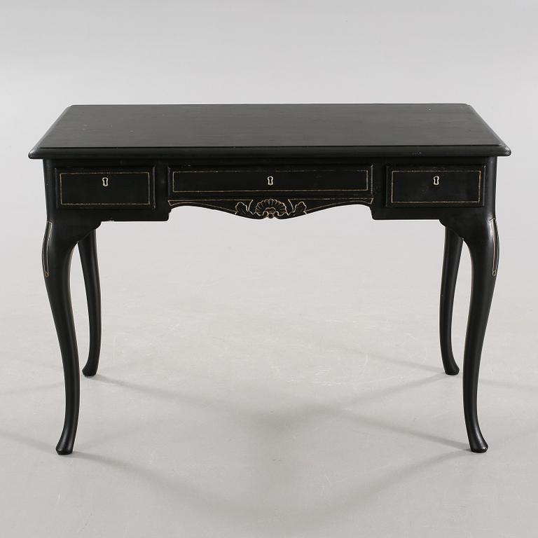 A 20th century desk in the style of rococo.