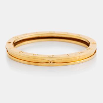 An 18K gold Bulgari bangle.