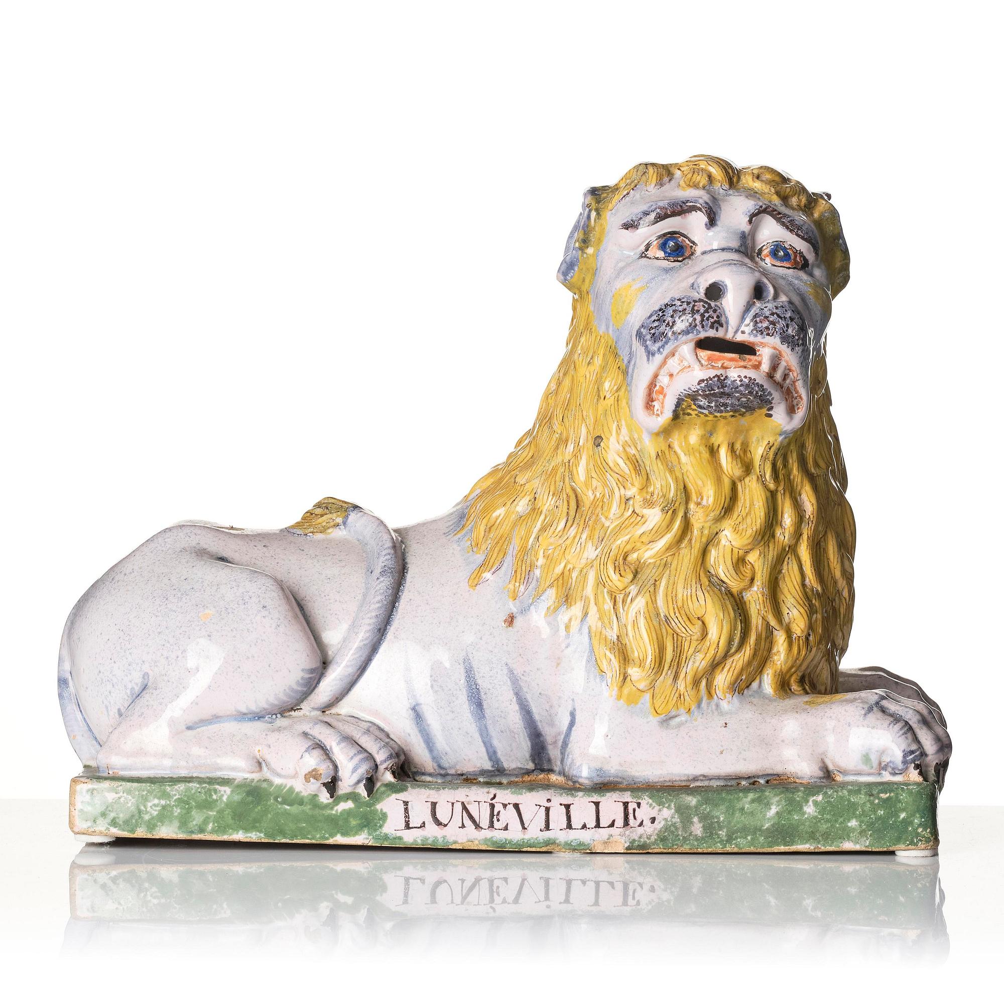 A pair of Luneville recumbent lions, circa 1780-1800.
