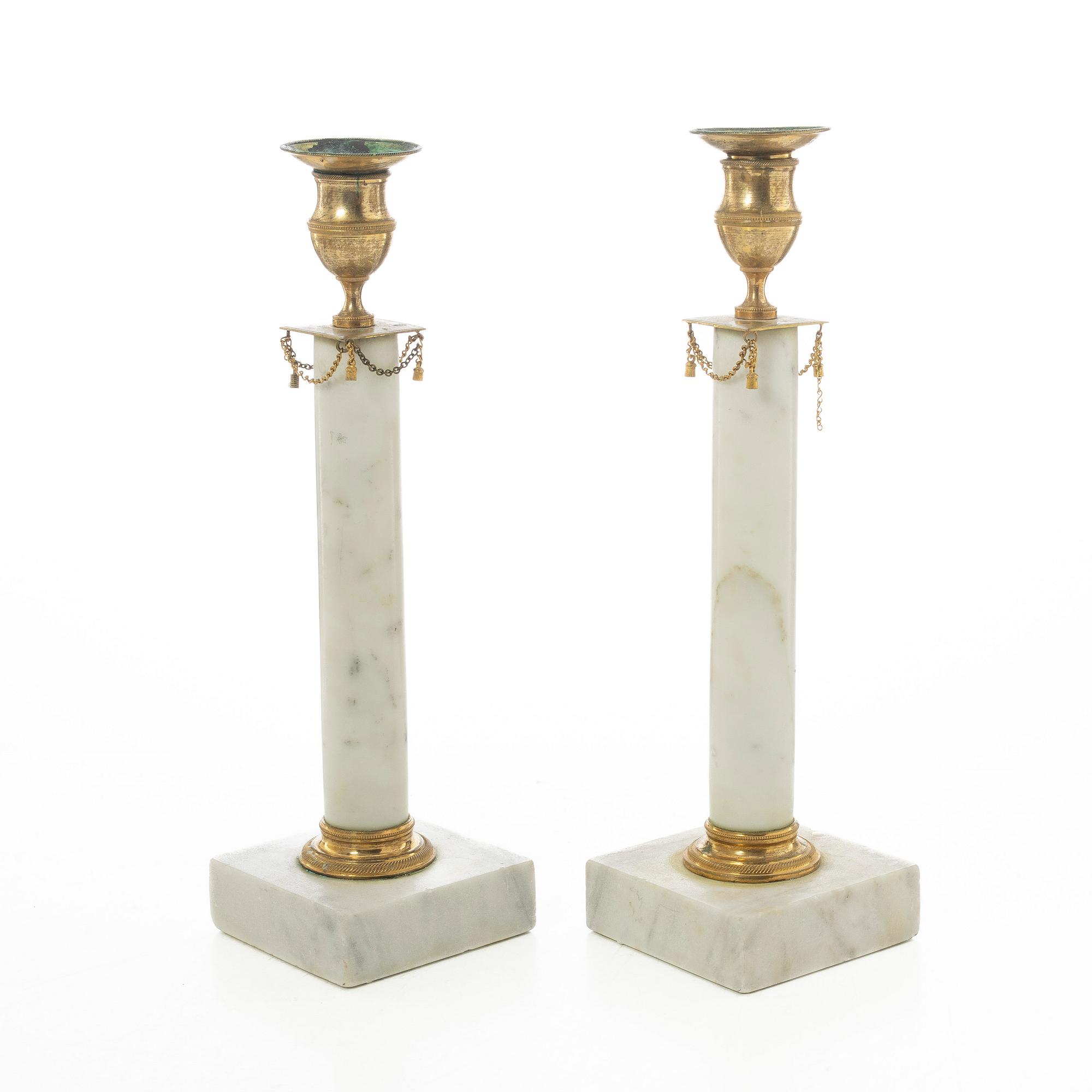 A pair of late Gustavian gilt brass and marble candlesticks, circa 1800.