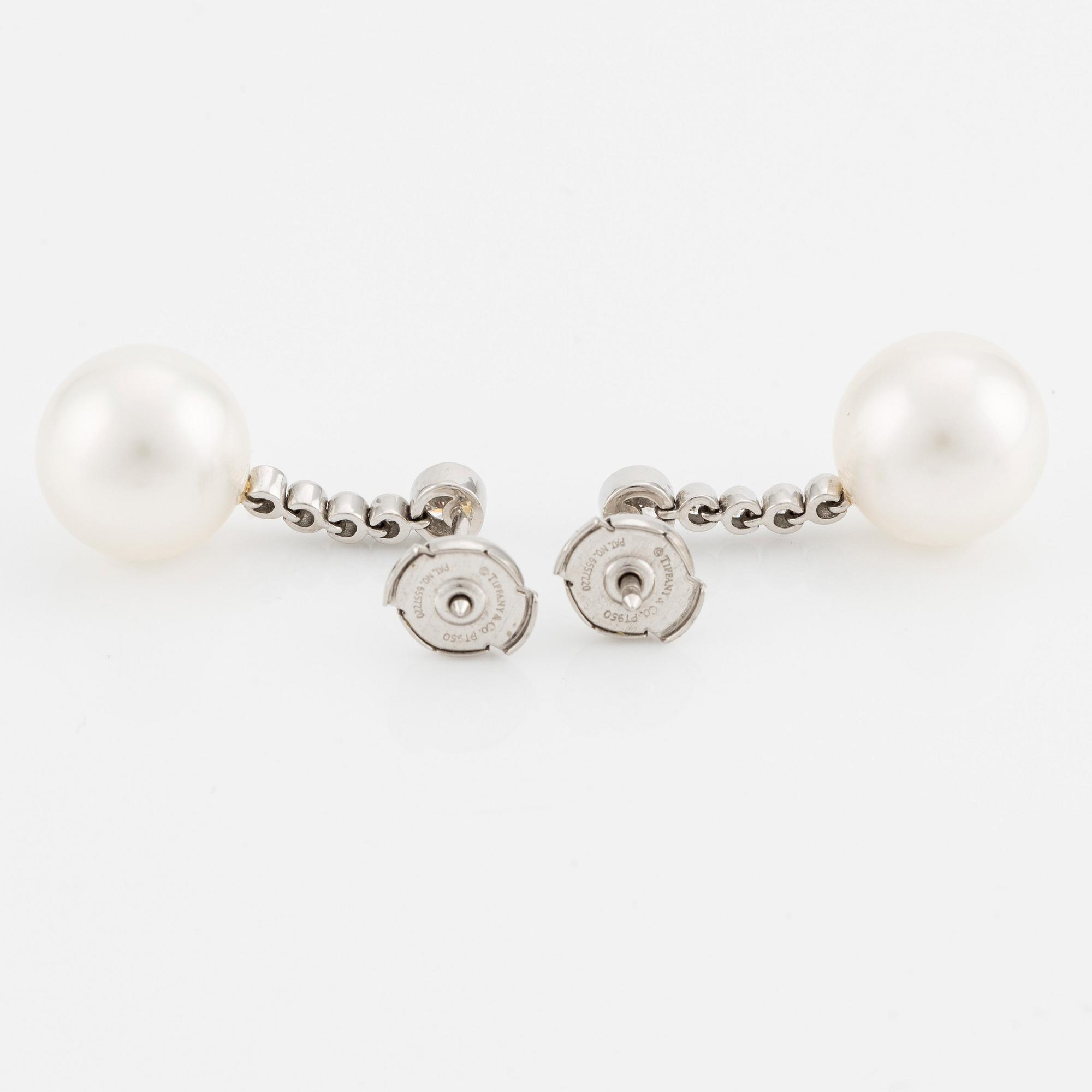 A pair of Tiffany & Co  platinum earrings with cultured pearls and round brilliant-cut diamonds.