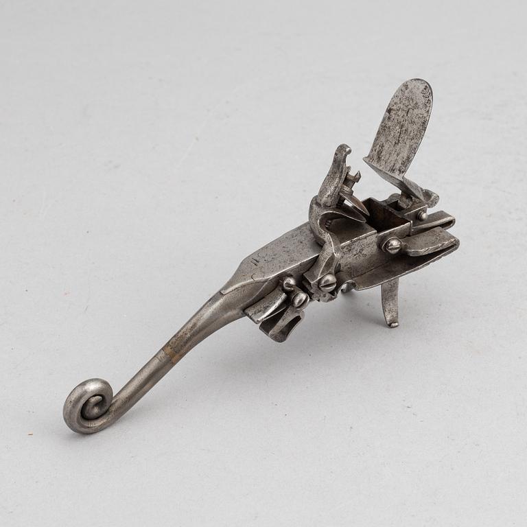 An 18th Century flintlock tinder lighter.