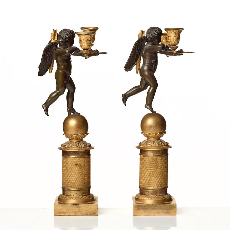 A pair of French Empire two-light candelabra.