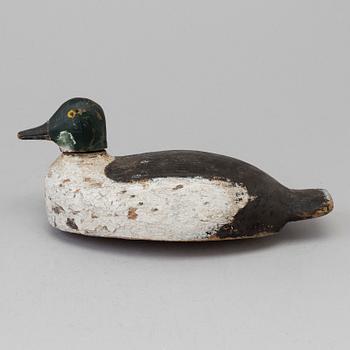 A duck hunt wood decoy circa 1900.