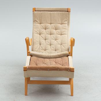 Bruno Mathsson armchair, "Pernilla" with footstool, Dux, late 20th century.