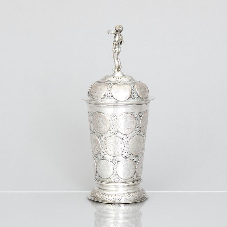 An 19th century parcel-gilt silver cup with lid, unidentified makers mark, probably Nürnberg.