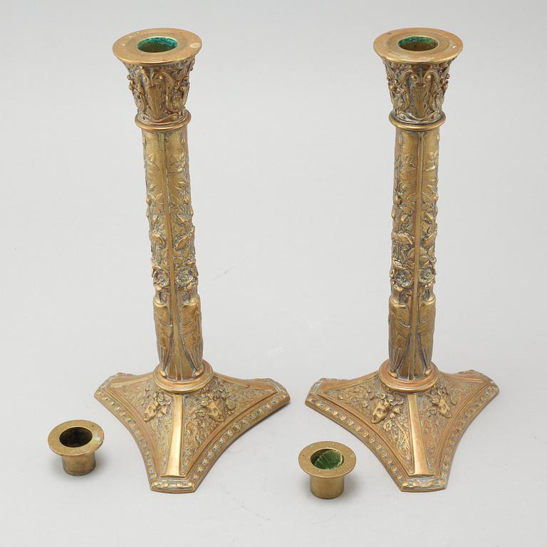 A pair of brass candlesticks from Elkingtons in Birmingham, 19th century.