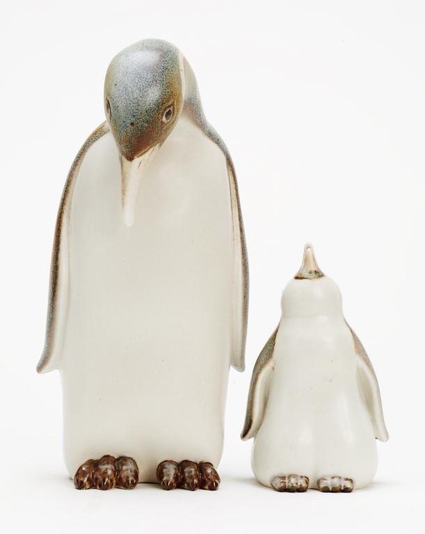 Two Gunnar Nylund stoneware figures depicting a penguin mother and child, Rörstrand.