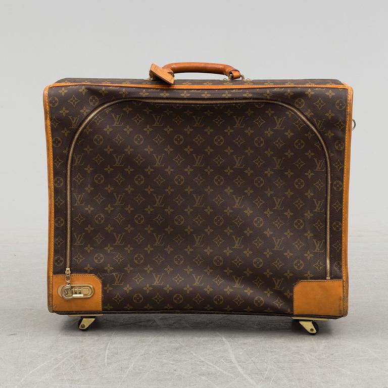 LOUIS VUITTON, a monogram canvas suitcase on wheels.