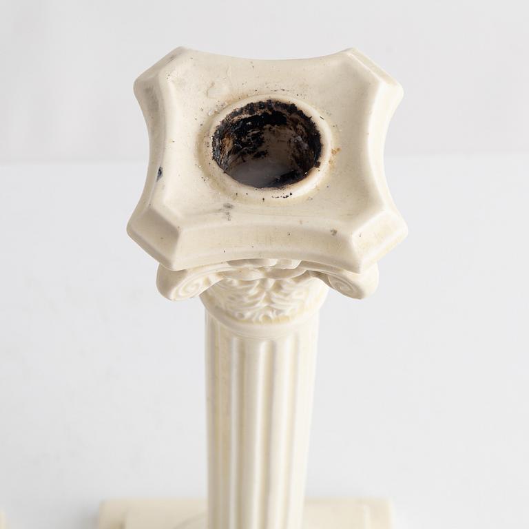 A pair of creamware candlesticks, around 1900.