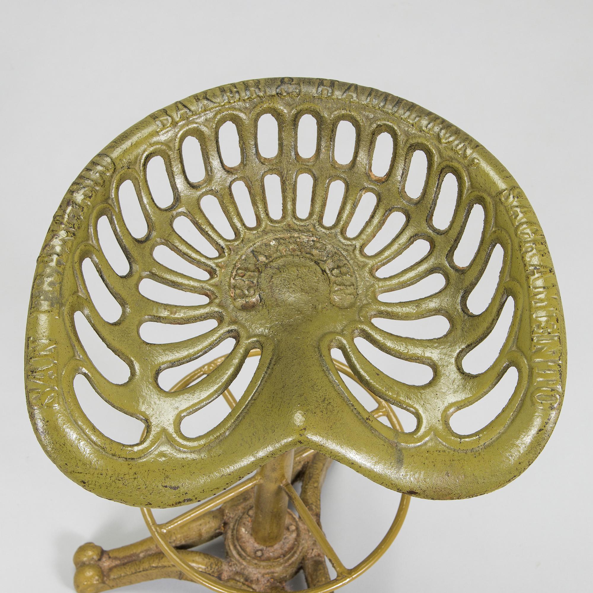 Four bar stools, painted cast iron, partly from the early 20th century.