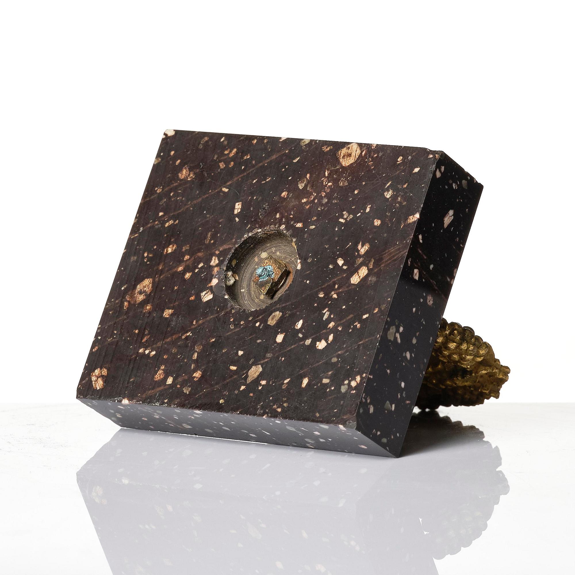 An Empire 'Loka-Risberg'-porhyry and ormolu paperweight, Älvdalen, early 19th century.