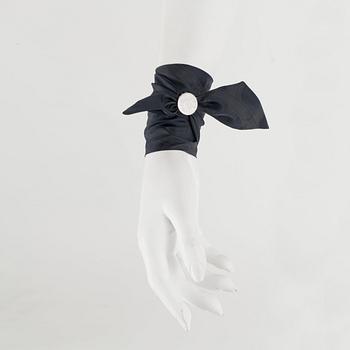 HERMÈS, three silk braclets with palladiumcovered locks.