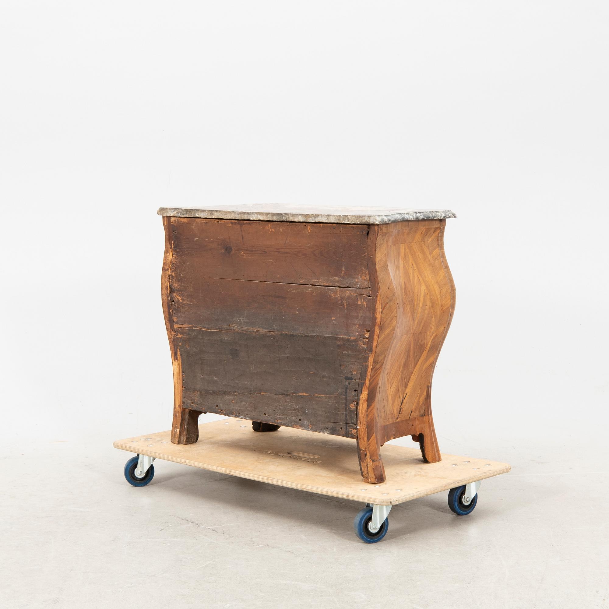 A mid 1700s Rococo dresser.