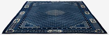 A semi-antique Baotou carpet, West China, c. 335 x 246 cm.