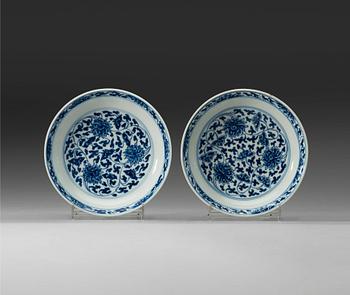 19. A pair of blue and white lotus dishes, Qing dynasty (1644-1912) with Kangxi six characters mark.