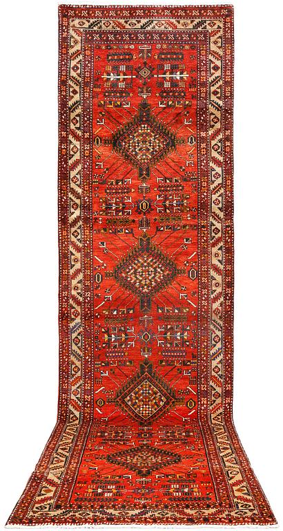 A Tabriz runner, c 430 x 115 cm.