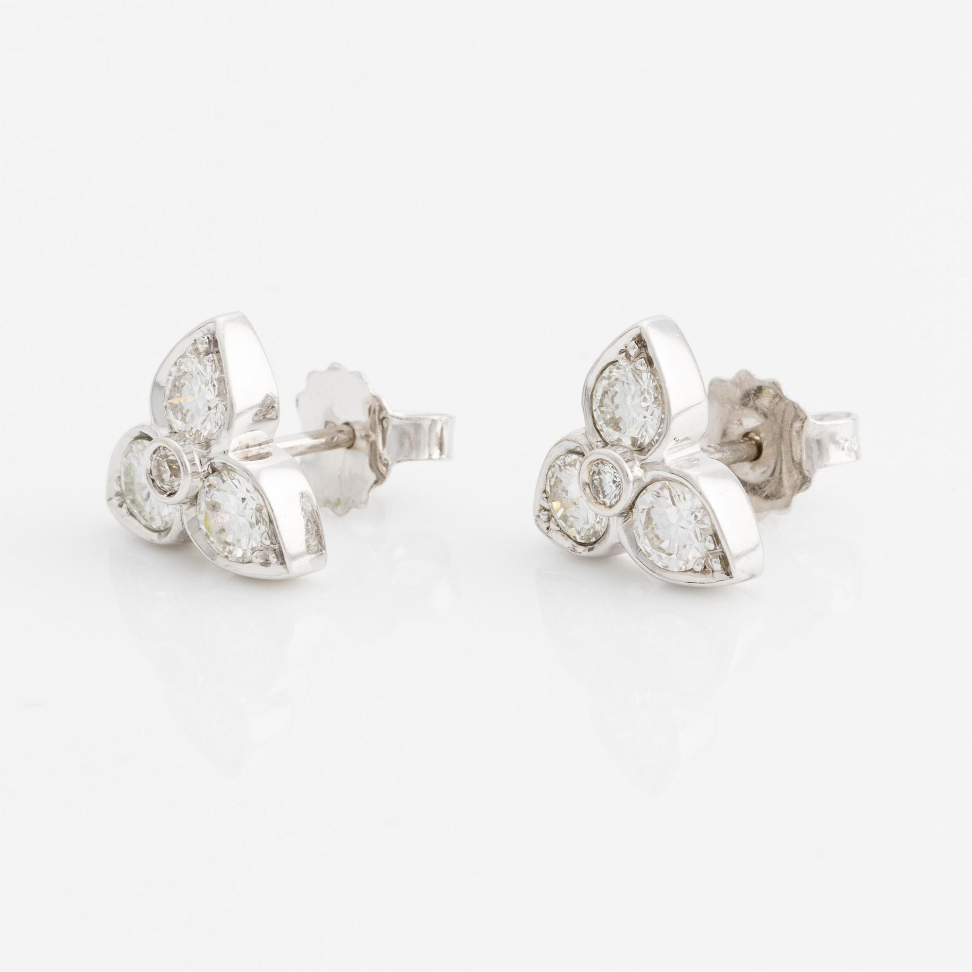 A pair of 18K white gold earrings with round brilliant-cut diamonds.