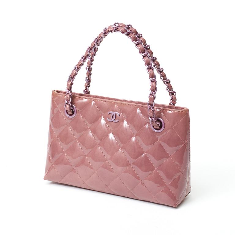 A quilted patent leather handbag by Chanel.