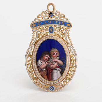 An 18K and 23 K pendant with enamel and miniature painting in qouache.  Probably France, 19th century.