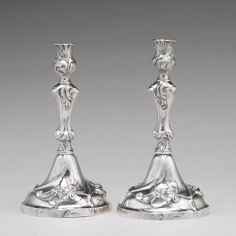 A pair of Swedish 18th century rococo silver candlesticks, mark of Jacob Lampa, Stockholm 1772.