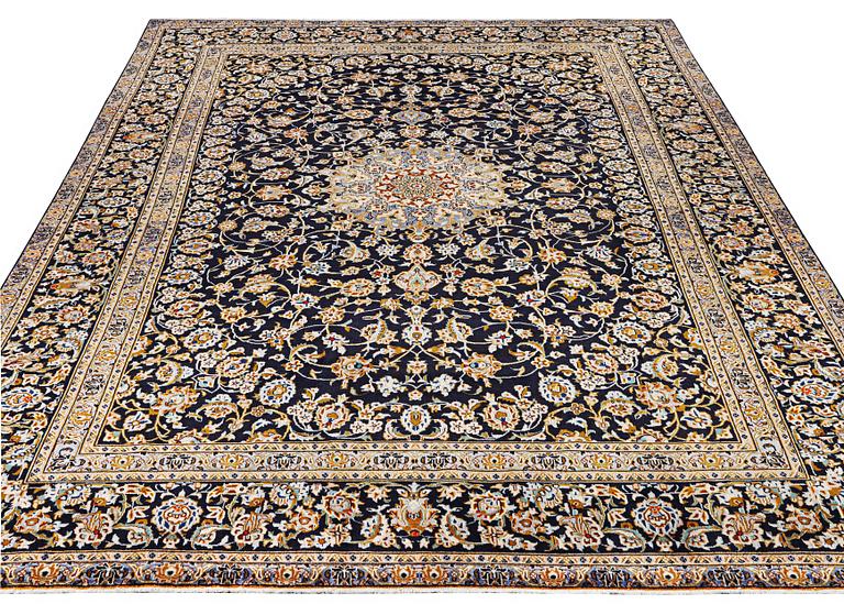 A Kashan carpet, c. 413 x 308 cm.