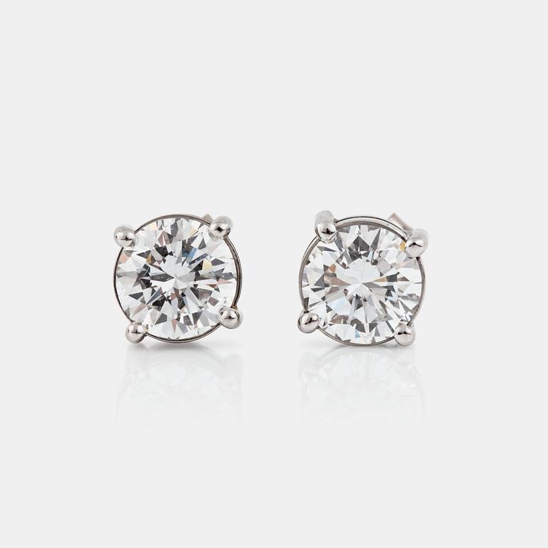 A pair of brilliant-cut diamond earrings. Total carat weight circa 2.79 cts. Quality circa E-F/VVS1 - VVS2.