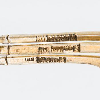 Twelve parcel-gilt teaspoons and a jam spoon, Russia 1887-1926.