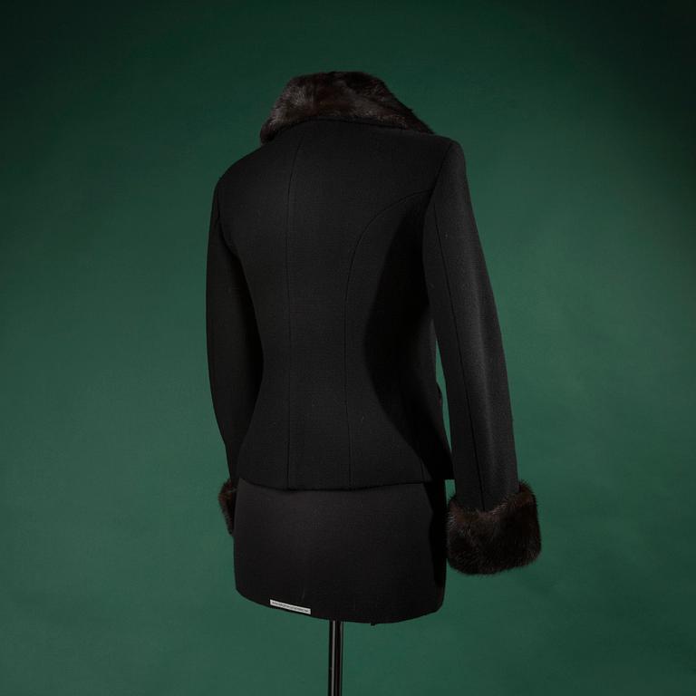 A jacket by MOSCHINO, in size 44(IT).