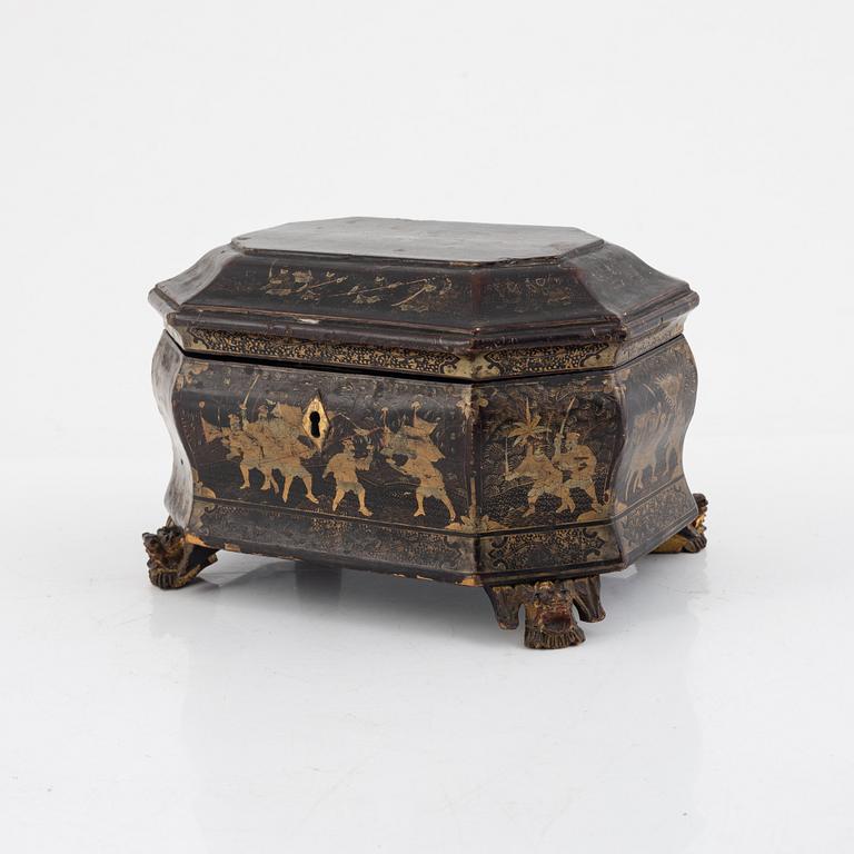 A Chinese lacquered tea caddy with pewter inserts, Qing dynasty, 19th century.