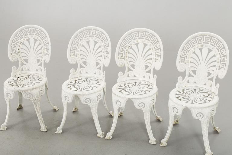 A SET OF FOUR GARDEN CHAIRS AND A GARDEN TABLE, turn of the century 2000.