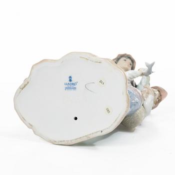 Salvador Furió, figurine, "A fishing lesson", and "A father's pride", Lladró, Spain.