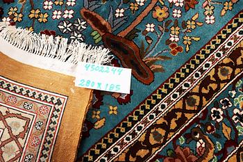 An all silk oriental carpet, a. 280 x 185 cm.