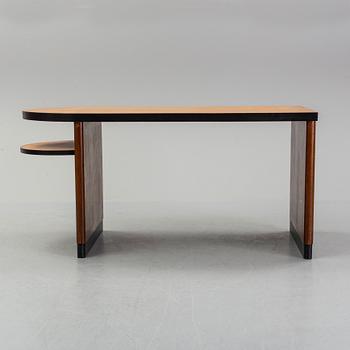 Axel Einar Hjorth, attributed to. A walnut and birch desk, Nordiska Kompaniet, 1930's.