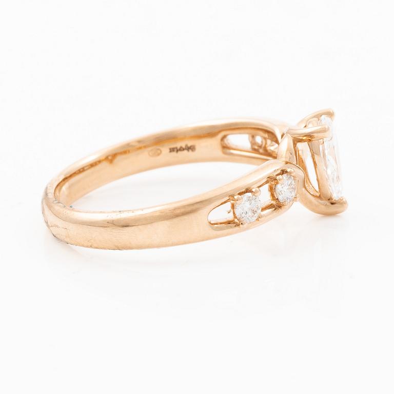 Ring 14K rose gold with a pear-shaped diamond and brilliant-cut diamonds, accompanied by an IGI report.