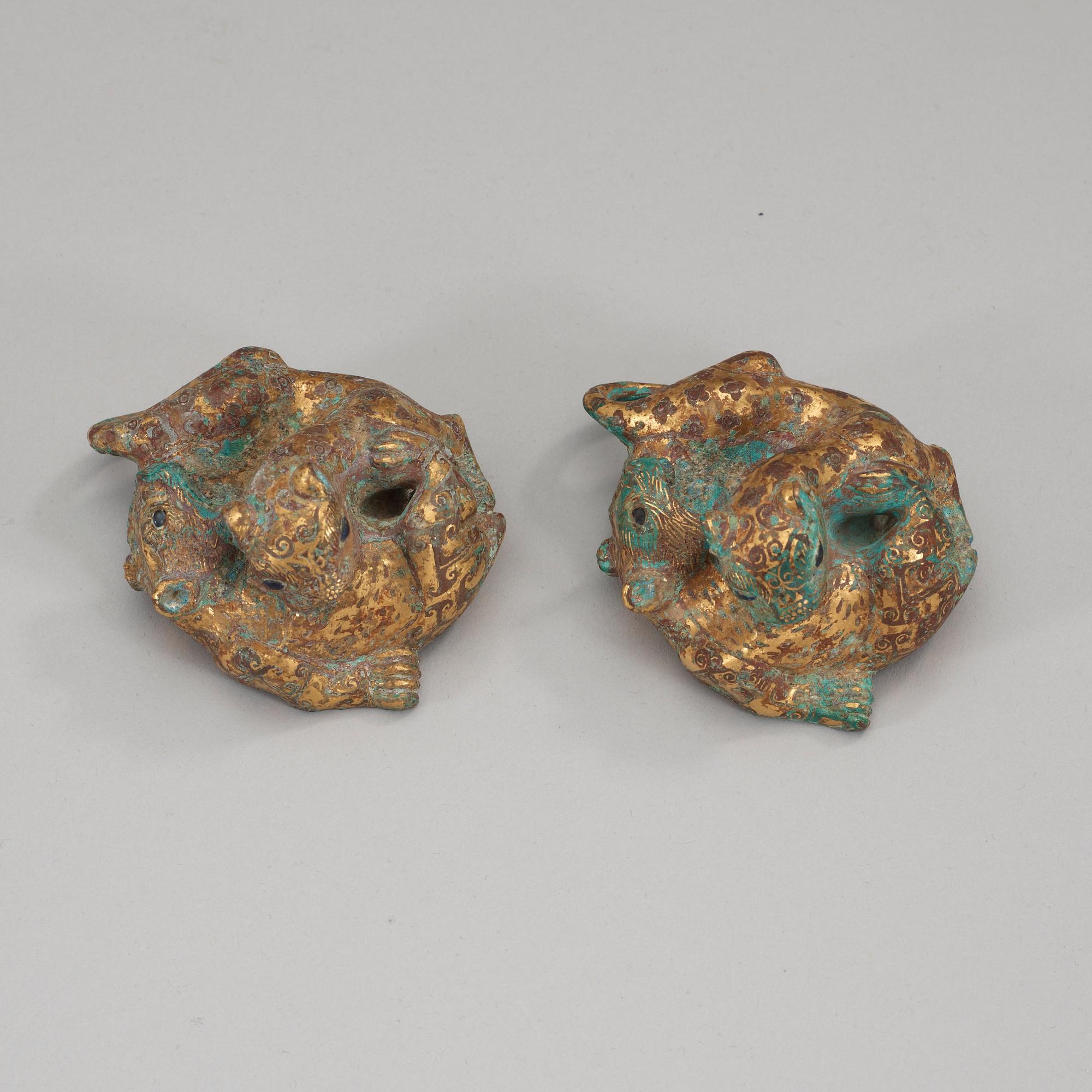 Two archaistic bronze weights, China.
