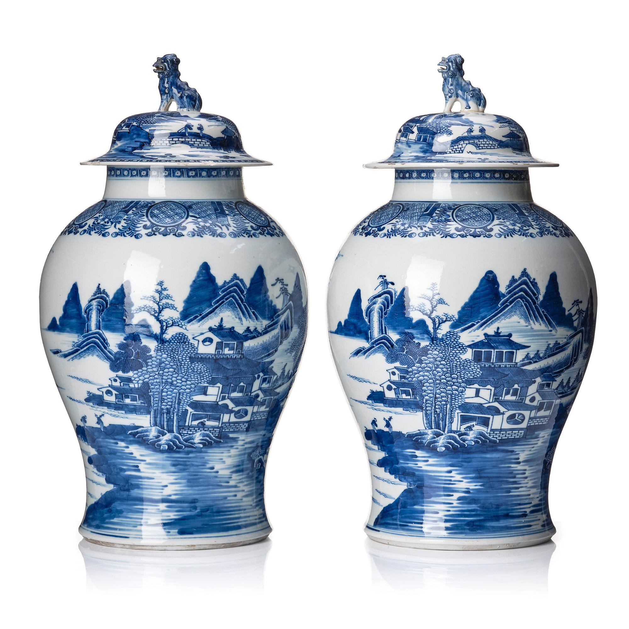 A pair of blue and white Chinese porcelain jars with covers. Qing dynasty, Qianlong (1736-95).