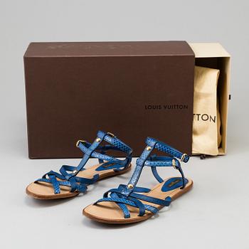 A pair of blue leather sandals by Louis Vuitton.