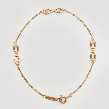 Tiffany & Co, an 18K gold 'Infinity Endless' bracelet.