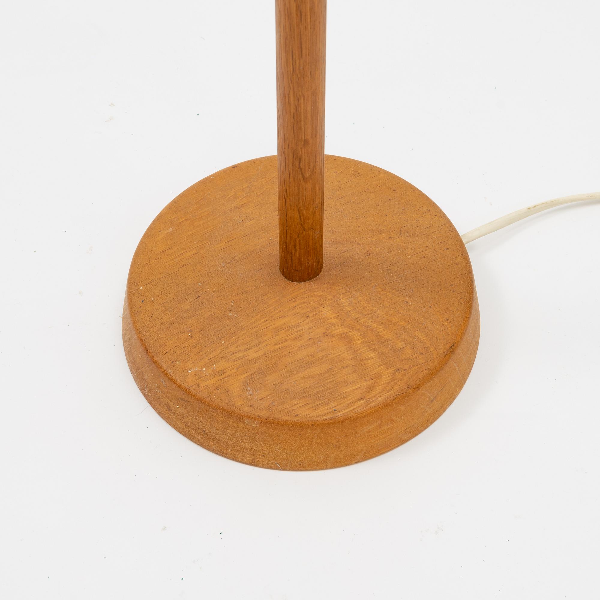 An oak floor lamp from Luxus, second half of the 20th Century.