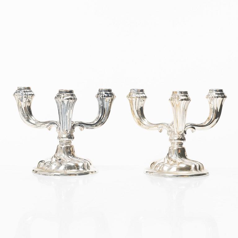 A pair of German silver candelabra, mark of Jakob Grimminger, Schwäbisch Gmünd, 20th century.