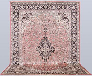 An older Ghom carpet, 398 x 293 cm.