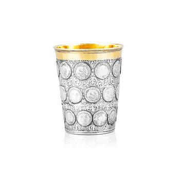 191. A German 18th century parcel-gilt silver coin-beaker, Frankfurt an der Oder, makers mark possibly ICST.